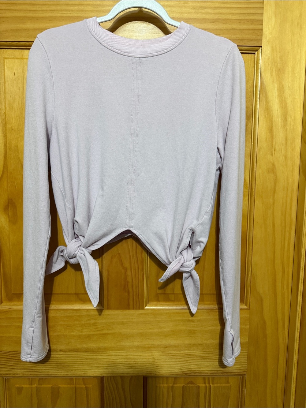 Athleta Long-Sleeve Tie-Hem Top in Light Pink, Size Medium.